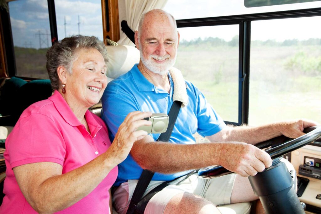 Senior couple using GPS to navigate their vacation motor home
