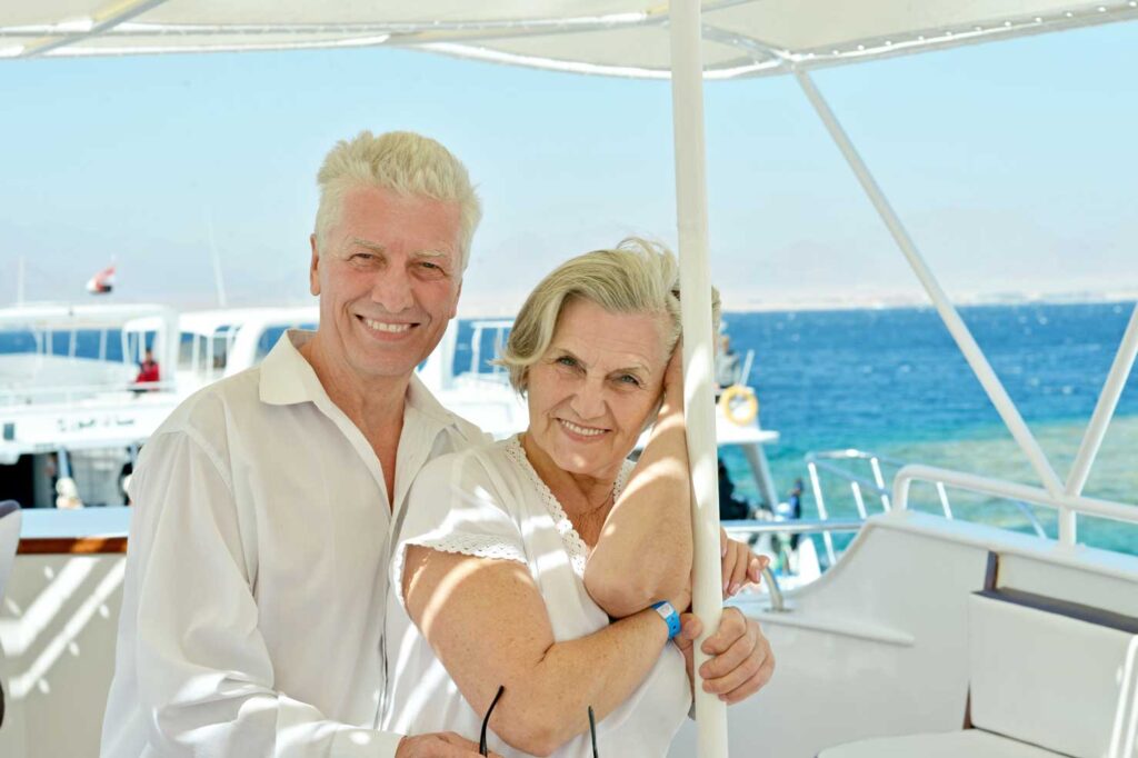 Seniors enjoying their retirement in a boat with A.S.A.G. Reverse Mortgage
