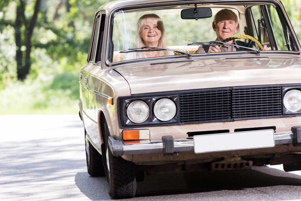 senior couple riding in a car