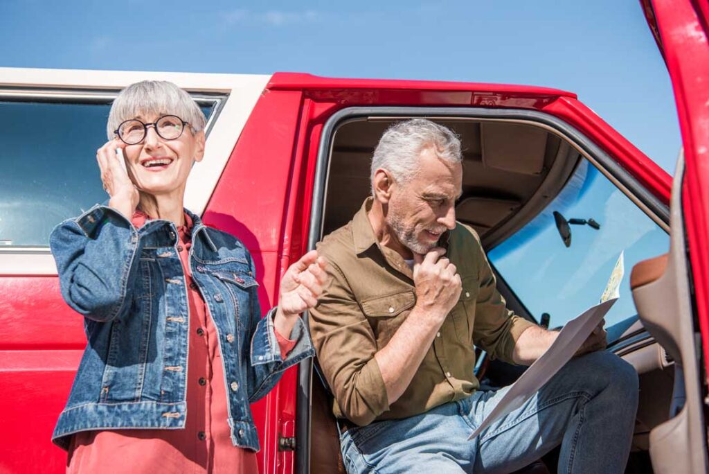 seniors on a vacation with their new car